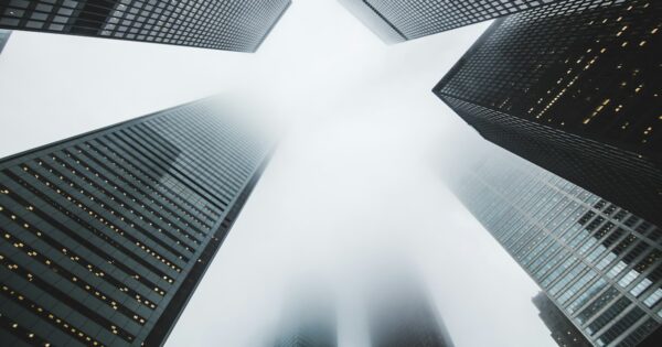 Skyscrapers partially obscured by fog